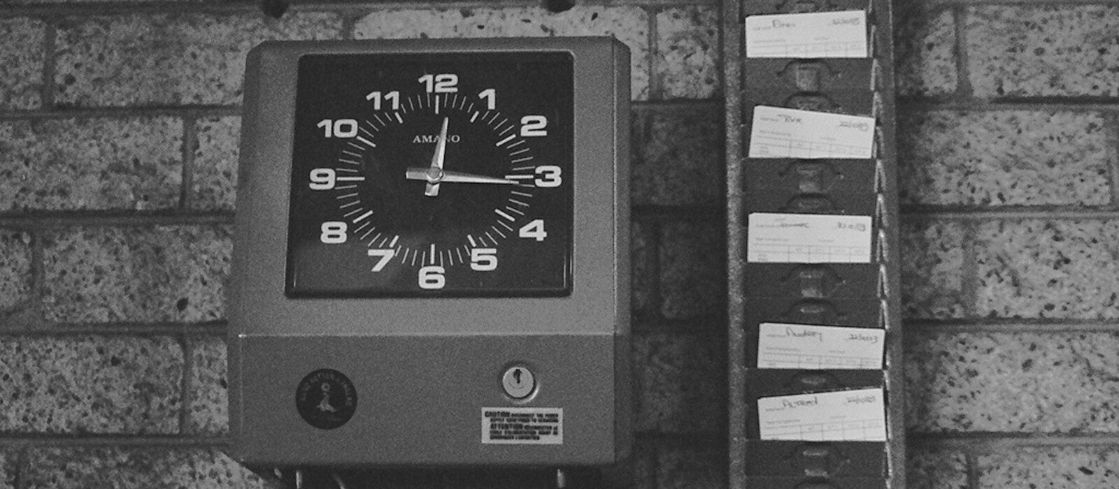black and white analog wall clock at 10 00