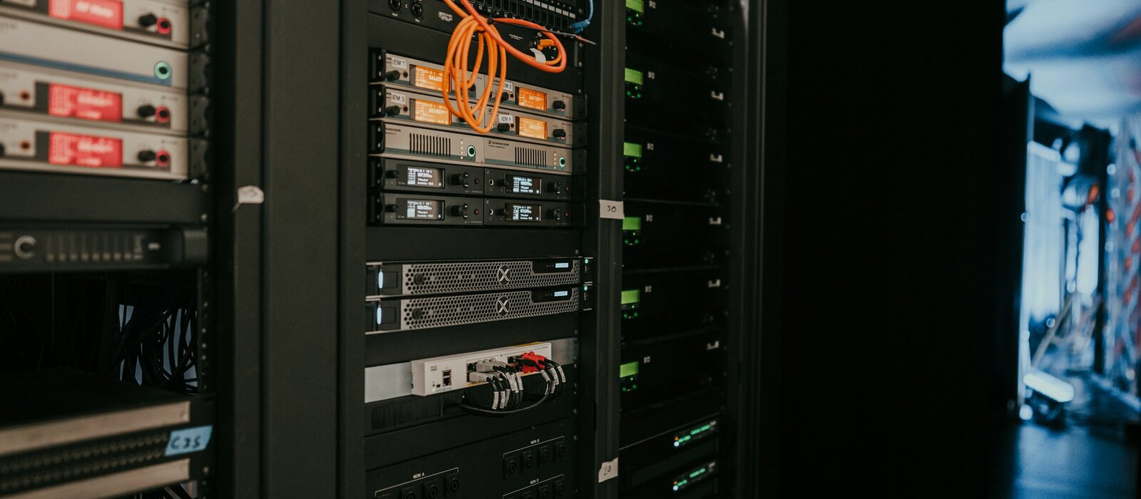 a rack of servers in a server room