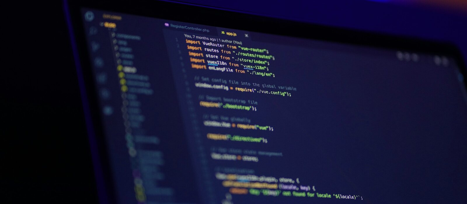 laptop screen displaying colorful code