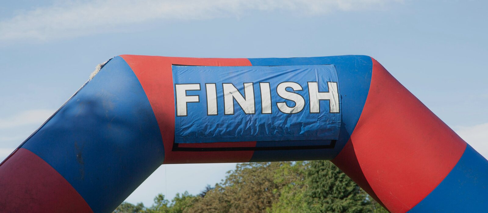 a large inflatable arch with the word finish on it