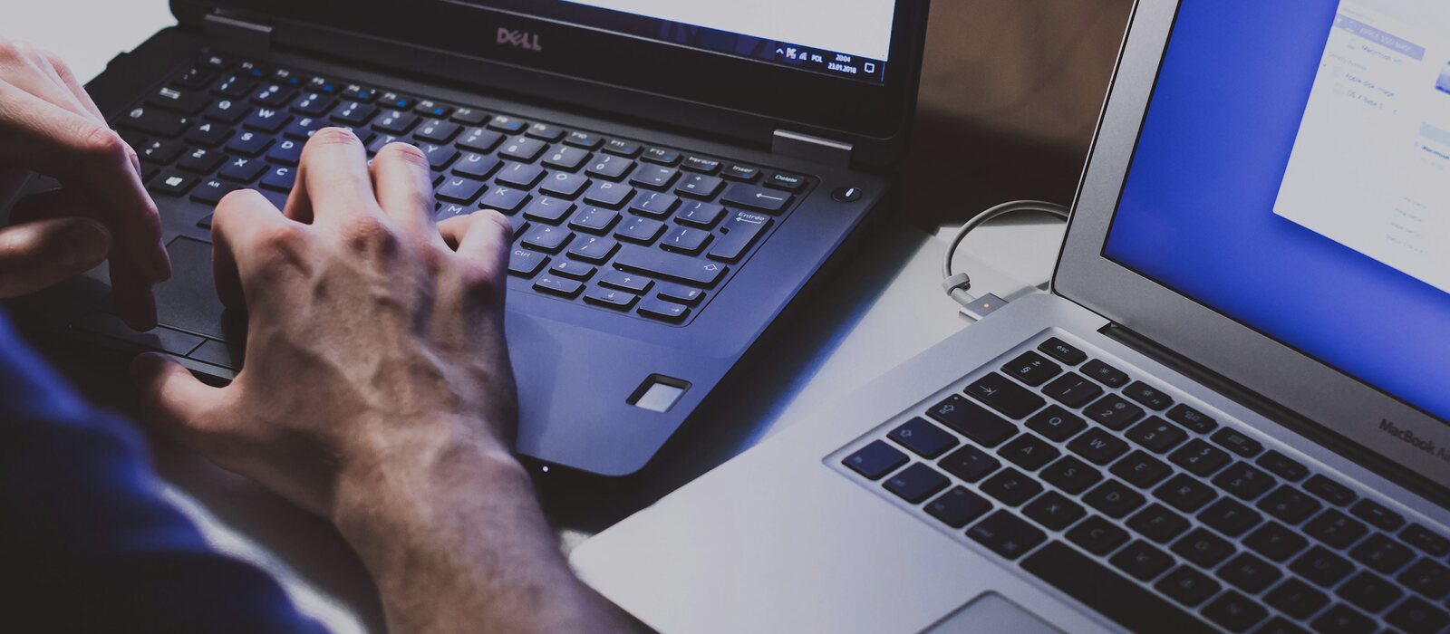 person using black laptop computer