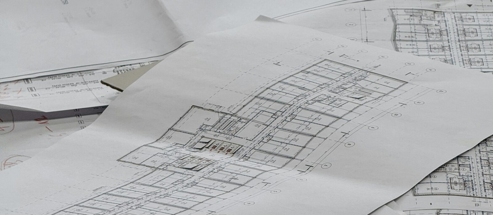Architectural blueprints spread out on a surface